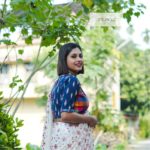 blue ikkat blouse with gamcha check khadi body work and frill