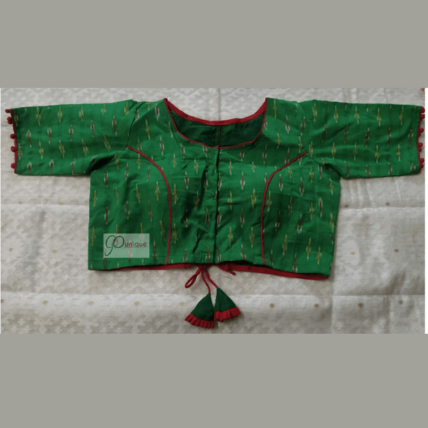 Green Ikkat Blouse With Red Piping And Frill