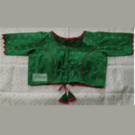 Green Ikkat Blouse With Red Piping And Frill