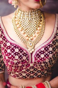 deep neck bridal blouse design with heavy stone work
