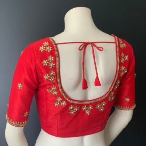deep red flower millet maggam work blouse design