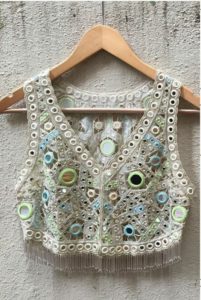 sleeveless mirror work blouse design with embroidery
