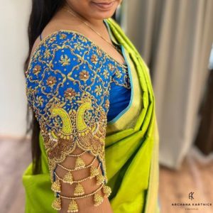 blue aari work blouse design with peacock embroidery