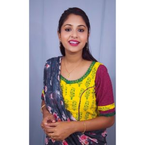 yellow ajrak with violet hakoba with green lace blouse